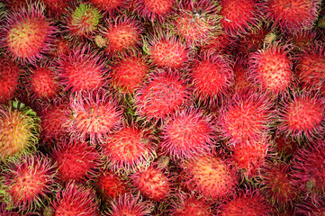 rambutan background / fresh ripe rambutan texture fruit tropics