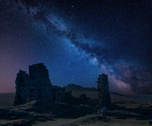Stunning Vibrant Milky Way Composite Image Over Abandoned Foggintor Quarry In Dartmoor With Raking Soft Sunlight Over Ruins And Derelict Buildings