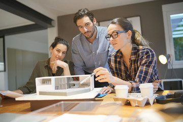 architects looking over project for modern house design