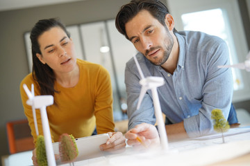 good looking engineers discussing turbines for wind farm