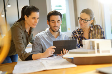 Architects looking over project for modern house design