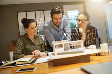 Architects looking over project for modern house design