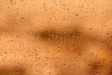 Fototapeta Tęcza - Gold tone for drops of water or rain drops on window glass