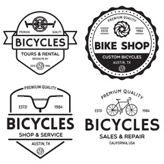 Wall Mural - Set of vintage and modern bike shop logo badges and labels. Cycle wheel isolated vector. Old style bicycle shop and repair logotypes.