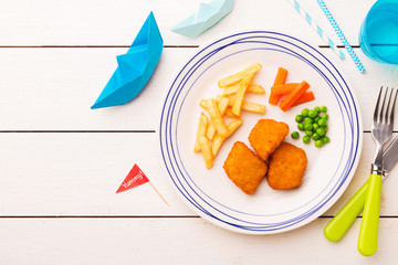 Wall Mural - Kid's meal (dinner) - fish, chips, carrot and green peas