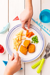 Wall Mural - Kid's meal (dinner) - fish, chips, carrot and green peas