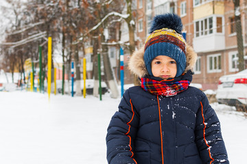 Wall Mural - boy walks in the winter outdoors