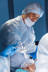 Canvas Print - Portrait of experienced doctor or surgeon during the operation