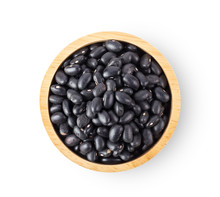 Black Beans In Wood Bowl Isolated On White Background. Top View