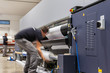 Big vinyl rolls, Computer aided printing process, advanced technology in the press and publishing sector, latest generation robotized plotting machines for mass production and big format prints.