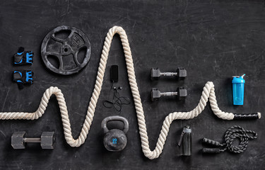 sports equipment on a black background. top view. motivation