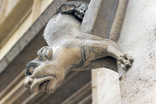 Gargoyles On The Wall Of A Medieval Building.
