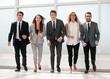 © ASDF - in full growth.a group of business people walking together.