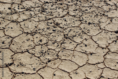 Fotografie, Obraz Part of a Huge Area of Dried Land Suffering from Drought - in Cracks