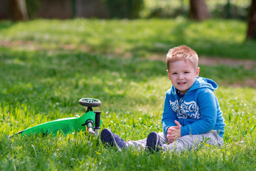 Little boy and on a grass