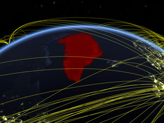 Greenland on planet Earth at night with international network representing communication, travel and connections.