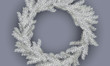 Vector White Christmas wreath. Christmas wreath of pine branches with silver frost.