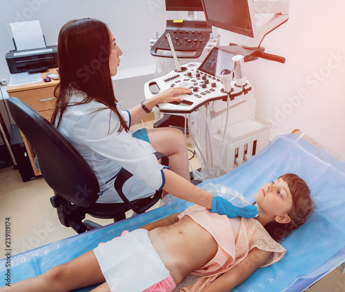 Medical Exam Of A Little Girl By Ultrasound Equipment Stock 写真 Adobe Stock Medical Exam Of A Little Girl By Ultrasound Equipment Stock 写真 Adobe Stock