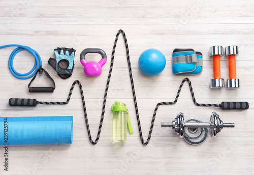 Cuadros en Lienzo Sports equipment on a white wooden background