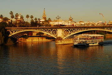 Wall Mural - the beautiful triana bridge in seville, on the guadalquivir