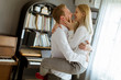 © BGStock72 - Loving young couple kissing in the room