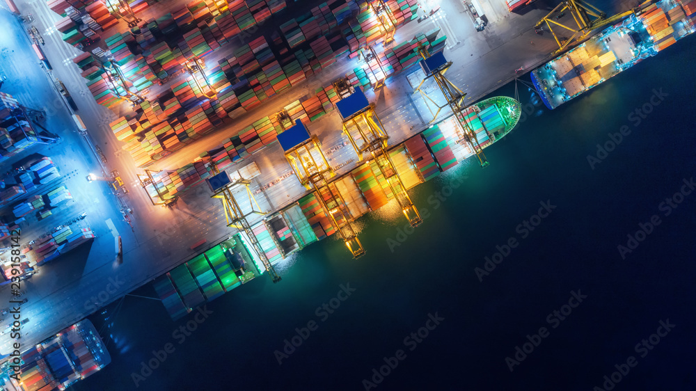 Aerial top view container ship at sea port and working crane bridge loading container for import export, shipping or transportation concept background. - obrazy, fototapety, plakaty 