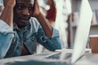 © Yakobchuk Olena - Nervous student sitting and looking at the screen of laptop