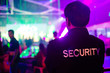 © iSomboon - security guard in night club.