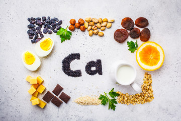 Wall Mural - Healthy products sources of calcium. Top view, food background, Ca ingredients on a white background.