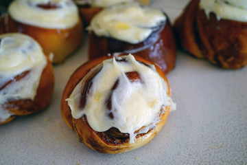 Wall Mural - Pumpkin cinnamon rolls with sugar icing