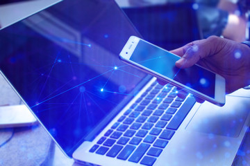 business man with smartphone mobile and laptop notebook computer in network social digital online connect to data concept