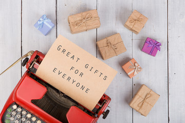 Poster - Holidays concept - red typewriter with craft paper and text 