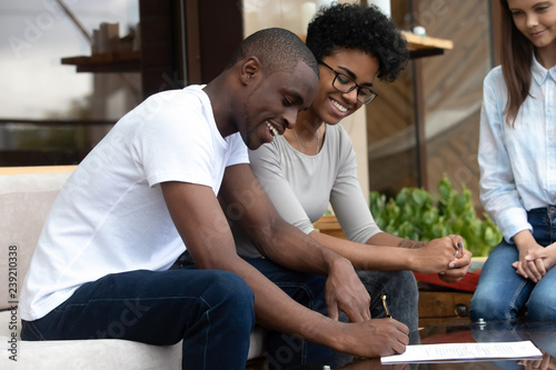 Happy African American Couple Signing Contract Making Agreement
