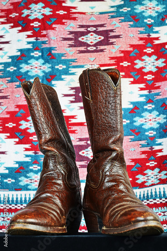 Fotografia, Obraz Vintage Caribou Hide Cowboy Boots against Colorful Indian Blanket