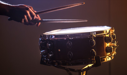 Wall Mural - man playing the snare drum on a beautiful colored background