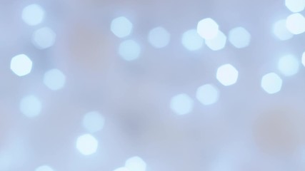 Abstract smooth azure bokeh lights on blurred blue background. Bright bokeh effect on defocused sparkling multicolor background. Holiday spirit. 