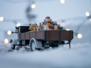 Wall Mural - Christmas truck with loaded gifts and bear. Christmas teddy bear and gifts loaded on a car.