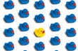 Group of blue toy ducks and only one desired duck on a white background. The concept of creative solutions, leadership, stands out from the crowd, uniqueness