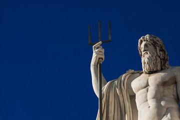 Wall Mural - Neptune God of the Sea. Marble statue with trident erected in 1823 in People's Square in Rome (with copy space)