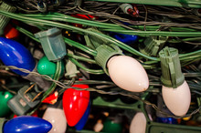 Pile Of Tangled Large Bulb Christmas Lights With Green Wire