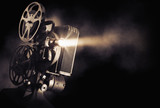 Fototapeta Mapy - film projector on a dark background