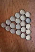 Bottle Cap Marks Arranged Neatly On Top Of The Tray
