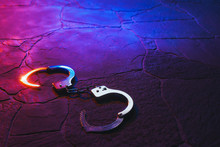 Handcuffs On The Floor At Night