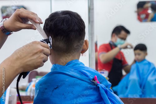 Little Asian Boy And Black Hair Age 4 Years Old Getting Haircut