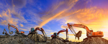 Many Excavators Work On Construction Site At Sunset,panoramic View