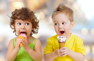 funny boy and girl eating ice cream