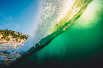 Ocean barrel wave at sunset. Perfect wave for surfing in underwater