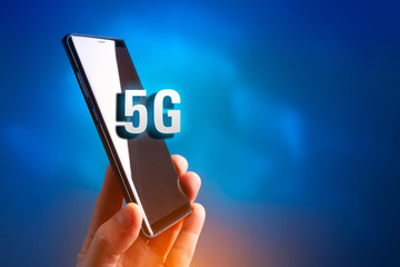 Aufkleber - Cellular. 5G. Cellular telephone. 5G broadband network. The fifth generation of mobile communications. Phone in hand. Data transfer rate Communication standard