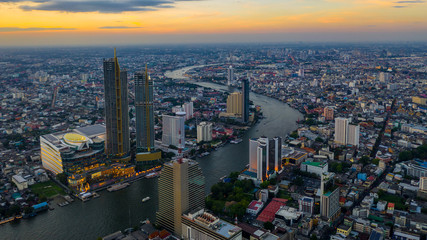 Wall Mural - Bangkok City at evening and Chaopraya River, aerial view, Bangkok, Thailand.