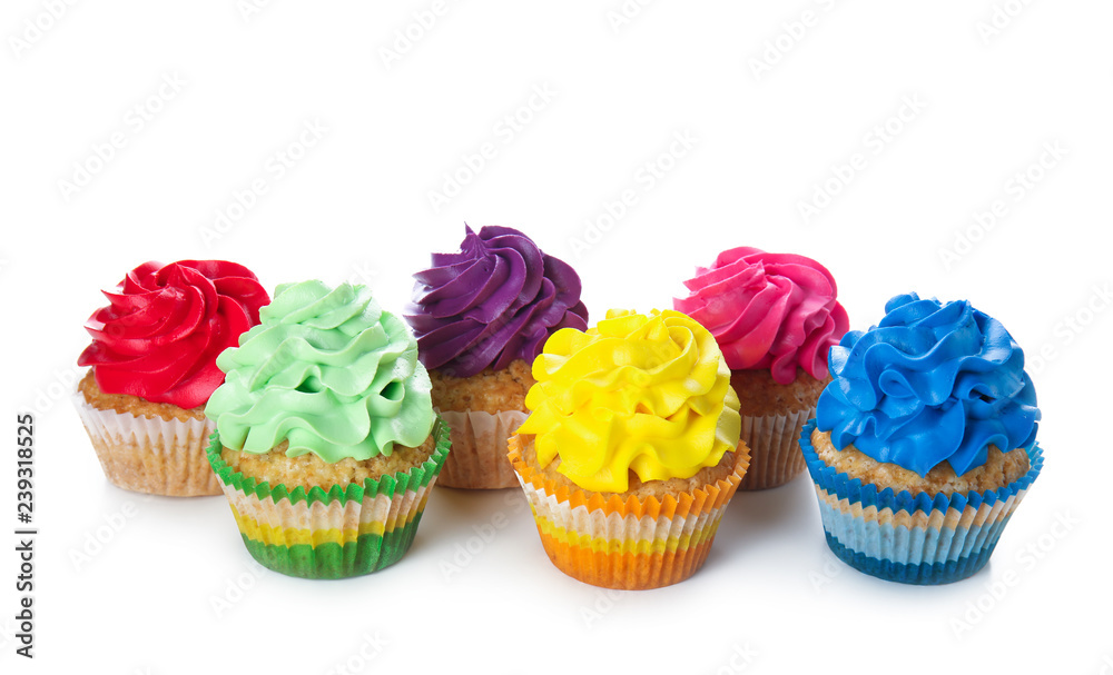 Delicious colorful cupcakes on white background